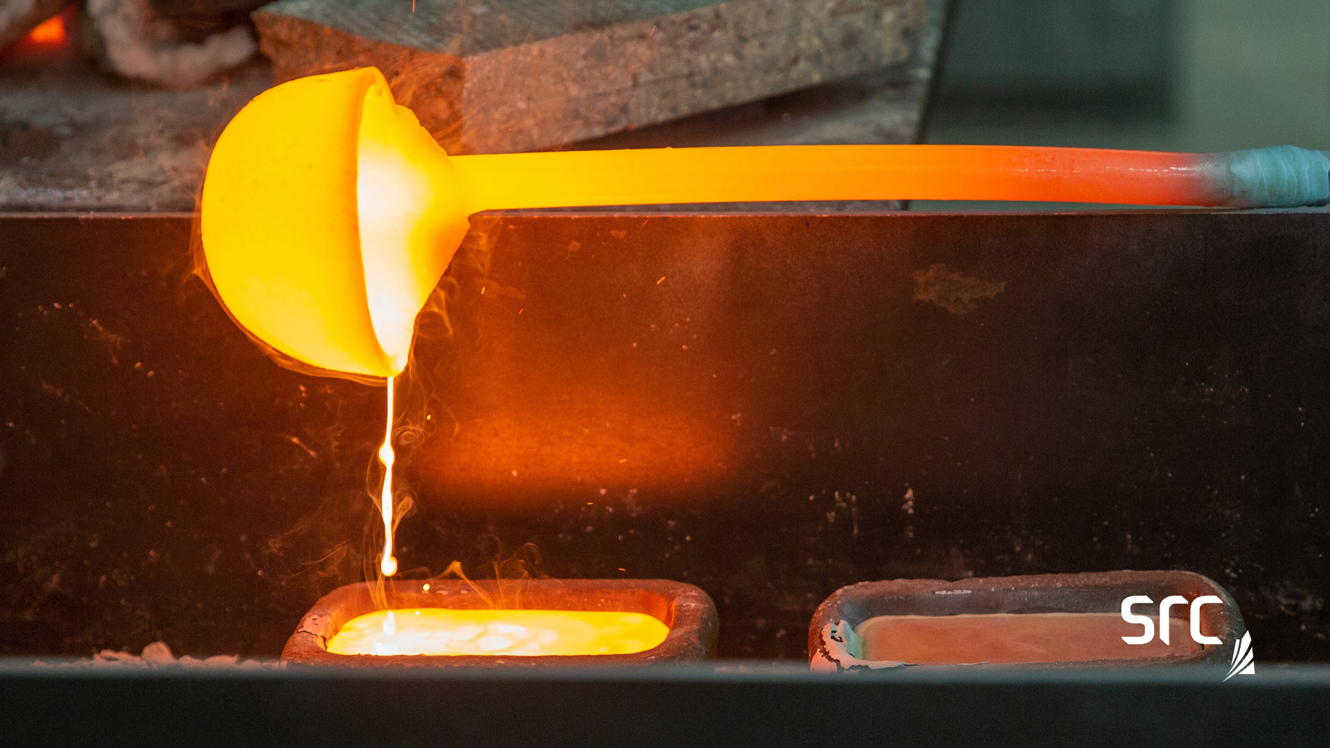 pouring molten rare earth metals into an ingot mold at src