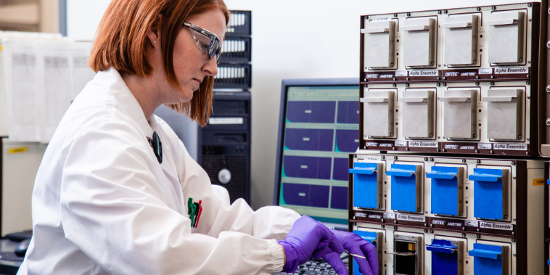 src lab employee performing radiochem test