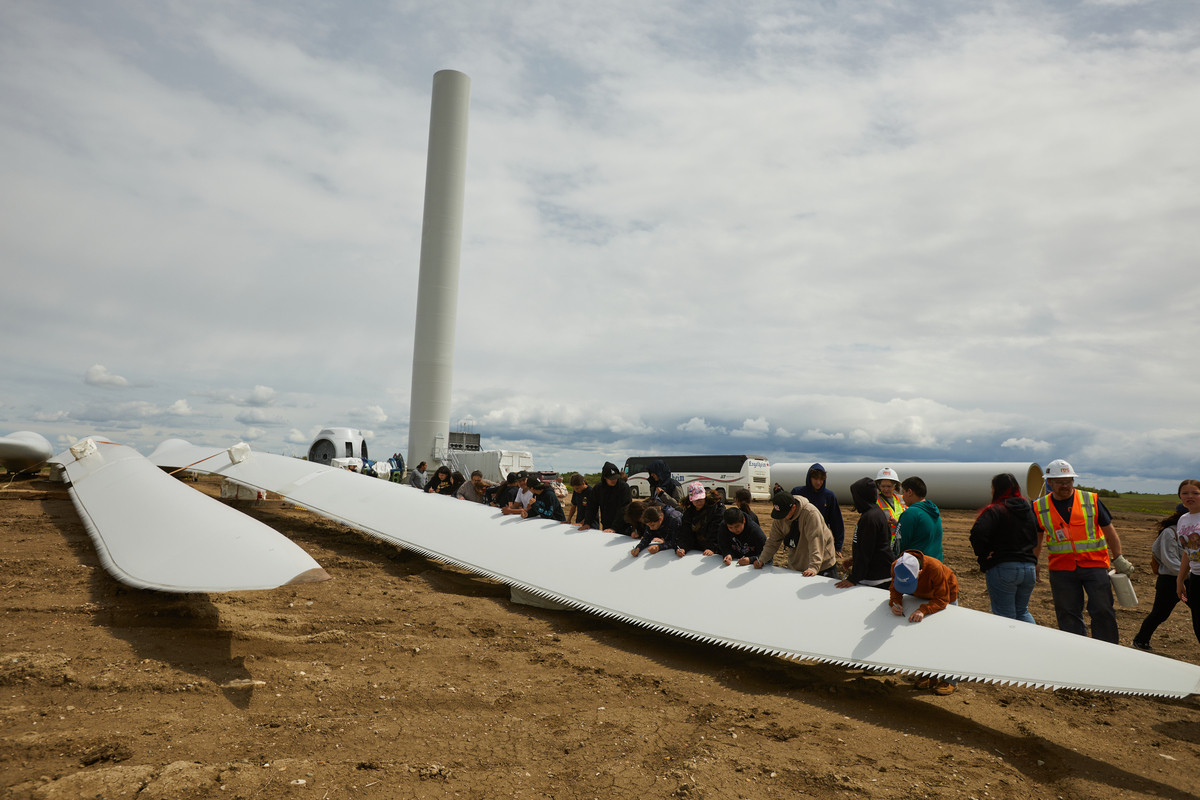 Youth from Cowessess First Nation signed one of the wind turbine blades before commissioning of the microgrid site