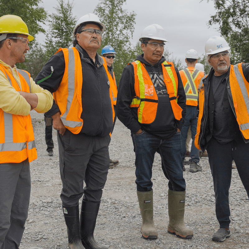 src community leadership tour men standing in safety vests at remediation site