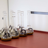 Long Neck Volumetric Flasks filled with Uranium samples under a fumehood at SRC